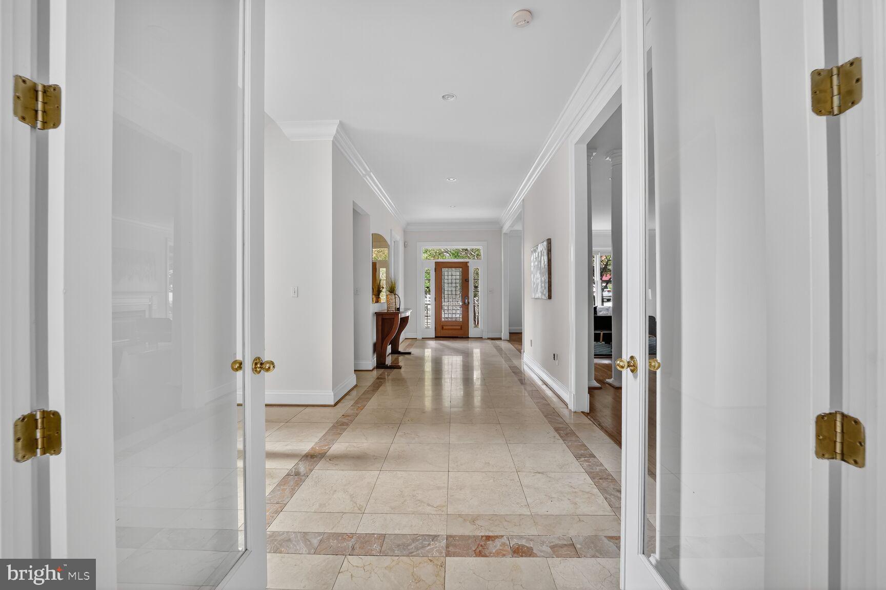 1829 47th Place Northwest Washington, DC 20007 - Photo 9 of 44 a view of a hallway with wooden floor and staircase