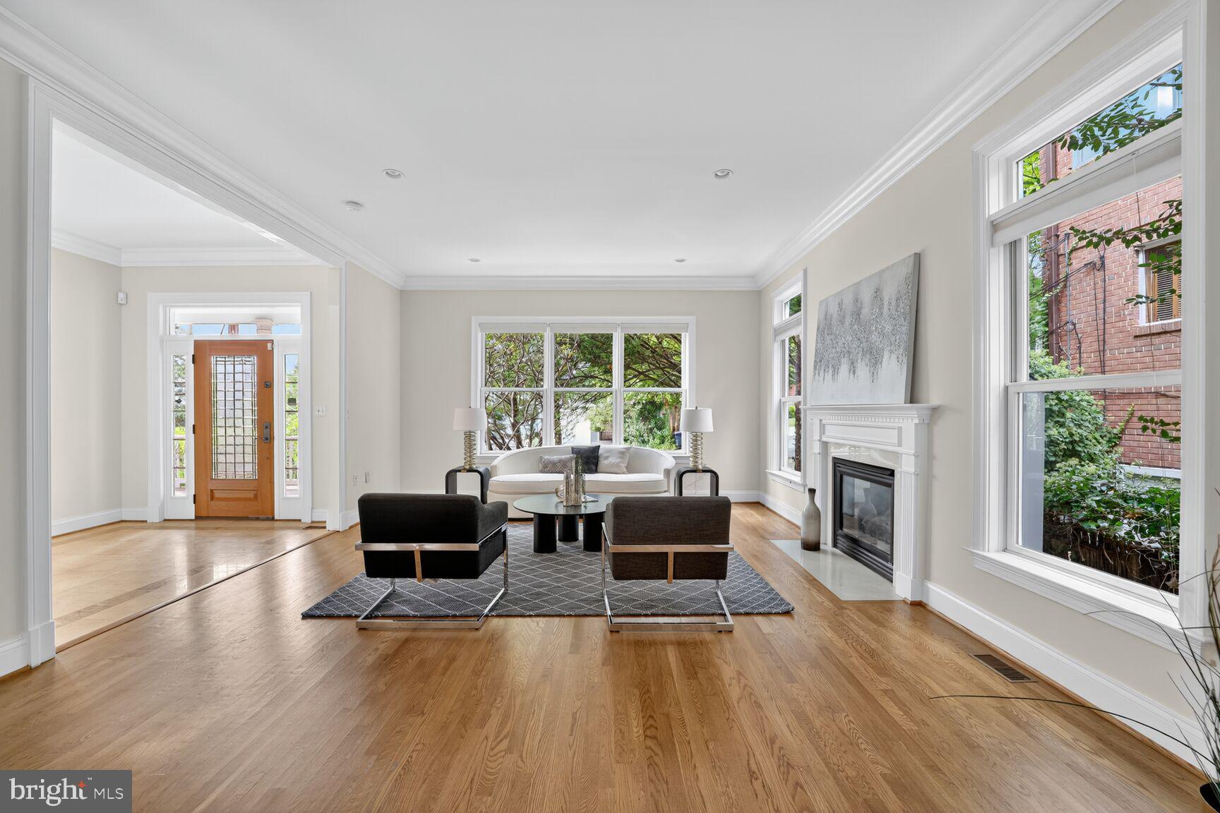 1829 47th Place Northwest Washington, DC 20007 - Photo 10 of 44 a living room with fireplace furniture and a large window