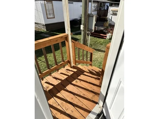 a view of balcony with furniture