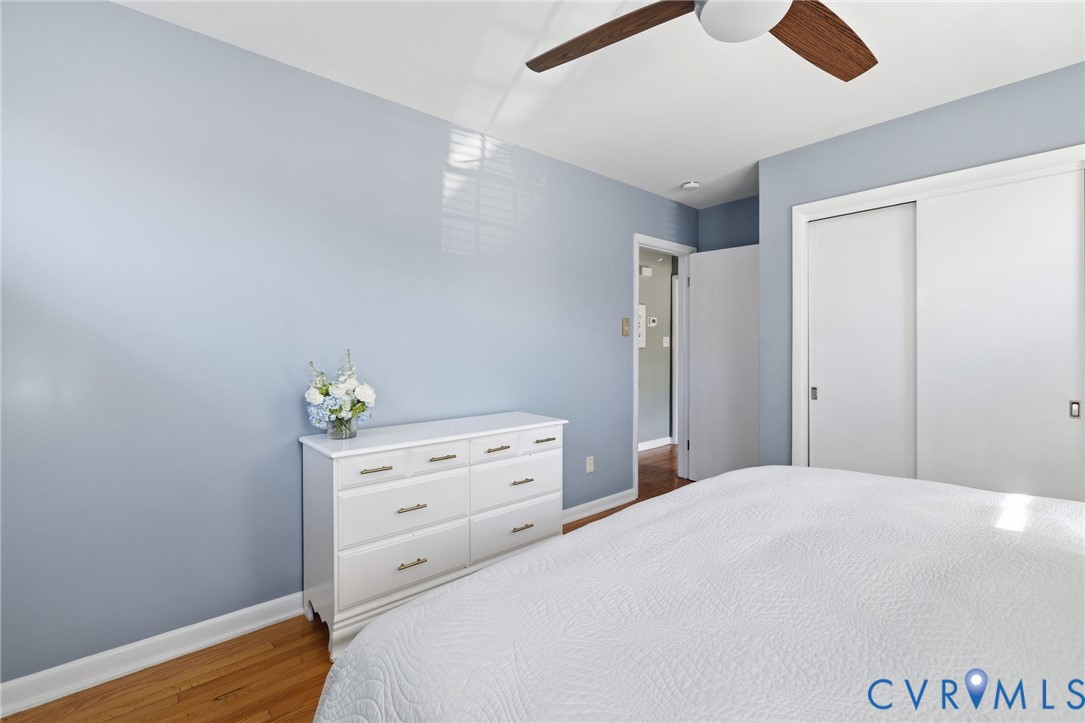 336 Lexington Road Richmond, VA 23226 - Photo 13 of 20 a bedroom with a bed and wooden floor