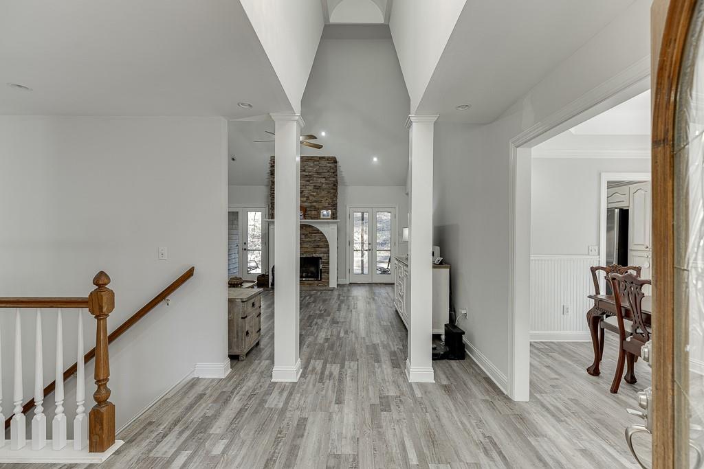 6360 Nix Road Dawsonville, GA 30534 - Photo 17 of 58 a view of a hallway view with wooden floor and staircase