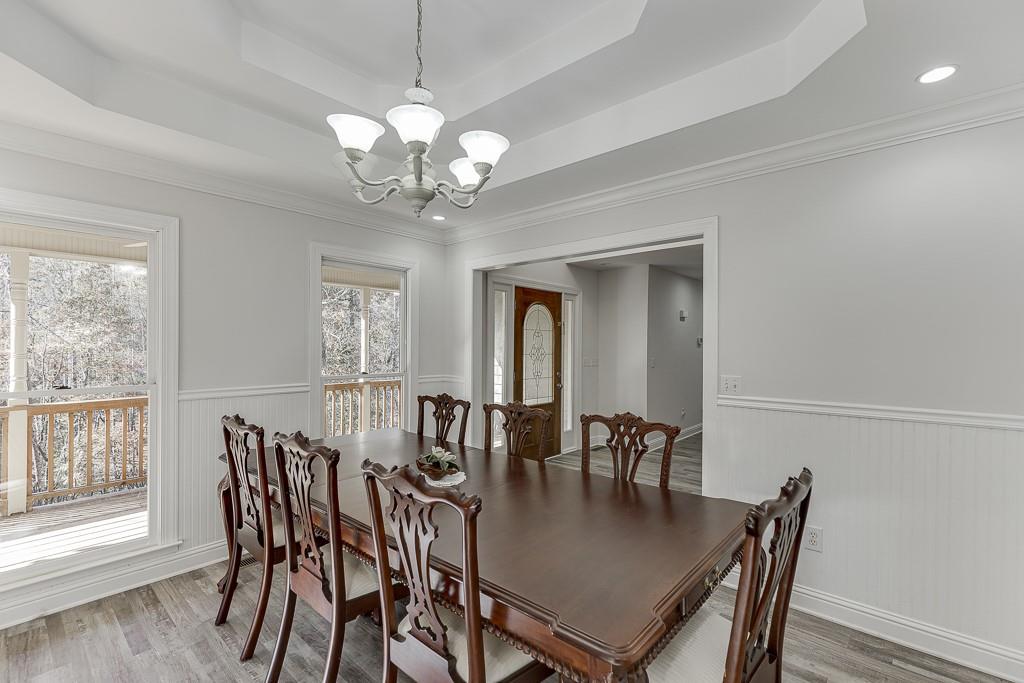 6360 Nix Road Dawsonville, GA 30534 - Photo 19 of 58 a view of a dining room with furniture window and wooden floor