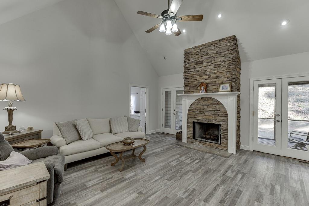 6360 Nix Road Dawsonville, GA 30534 - Photo 20 of 58 a living room with furniture and a fireplace