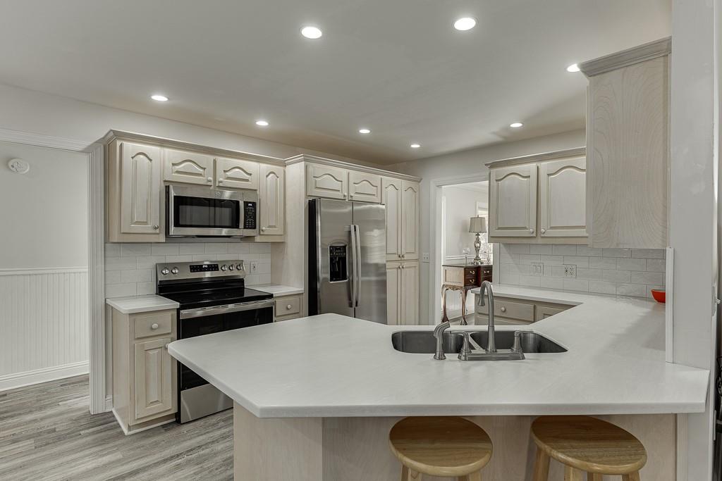 6360 Nix Road Dawsonville, GA 30534 - Photo 27 of 58 a kitchen with refrigerator and microwave