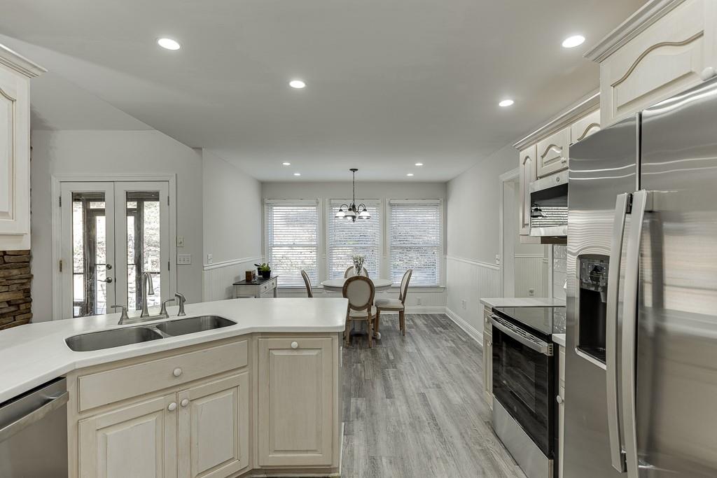 6360 Nix Road Dawsonville, GA 30534 - Photo 29 of 58 a large kitchen with a lot of counter space and a refrigerator