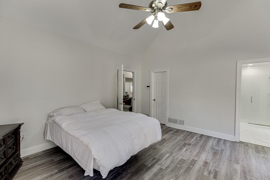 6360 Nix Road Dawsonville, GA 30534 - Photo 36 of 58 a bedroom with a bed and wooden floor