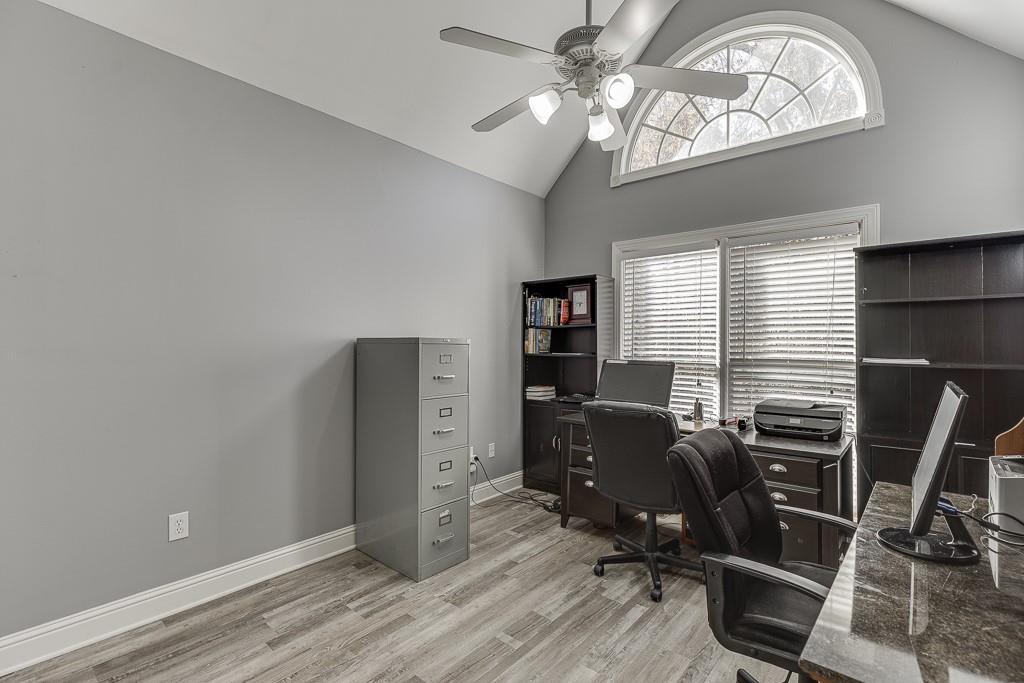 6360 Nix Road Dawsonville, GA 30534 - Photo 40 of 58 a view of a workspace with furniture and a window