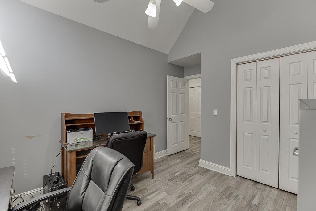 6360 Nix Road Dawsonville, GA 30534 - Photo 41 of 58 a view of a workspace with furniture and wooden floor