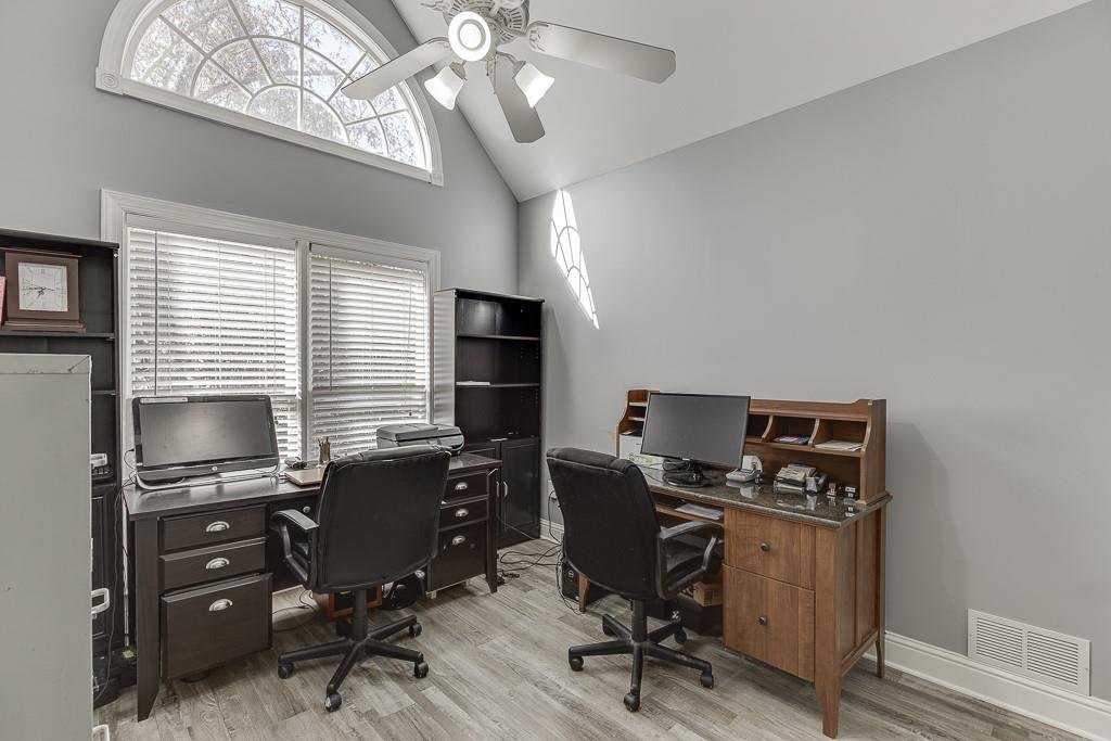6360 Nix Road Dawsonville, GA 30534 - Photo 42 of 58 a view of a workspace with furniture and a window