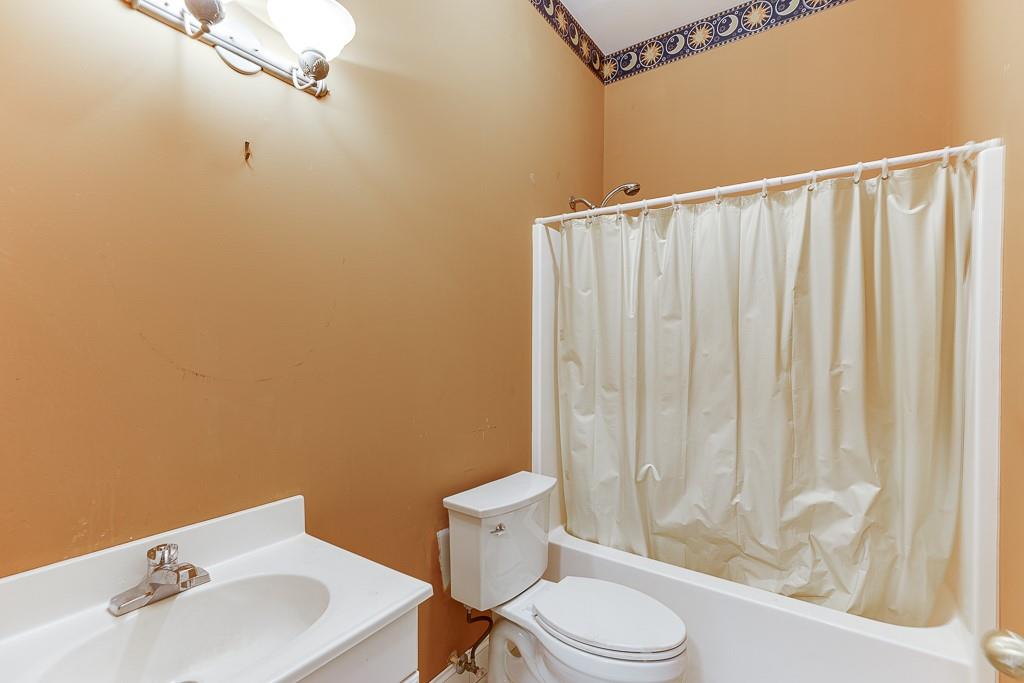 6360 Nix Road Dawsonville, GA 30534 - Photo 52 of 58 a bathroom with a sink a toilet and shower