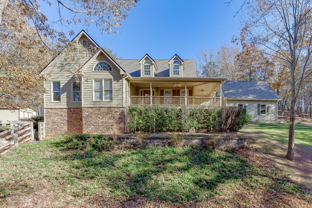 6360 Nix Road Dawsonville, GA 30534 - Photo 8 of 58 a front view of a house with a yard and garage