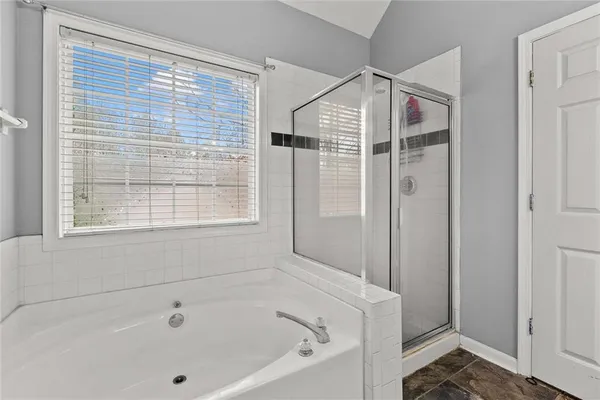 a white bath tub sitting next to a window