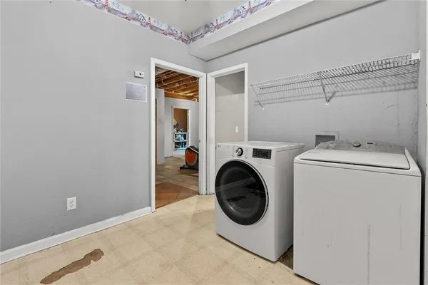 a utility room with dryer and washer