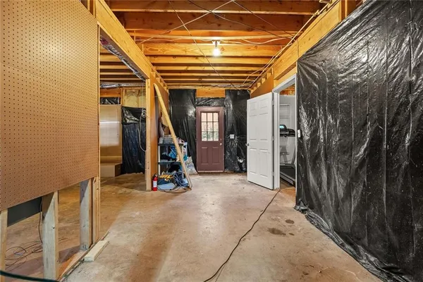 a view of a room with wooden floor and stairs