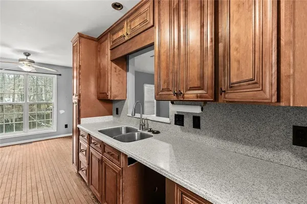a kitchen with stainless steel appliances a sink and cabinets