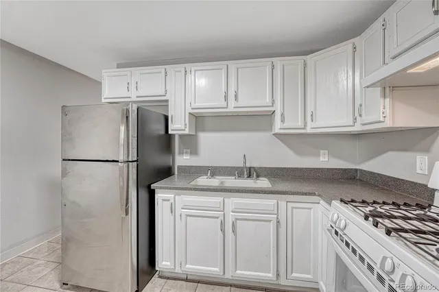 a view of a kitchen with an empty space and a window