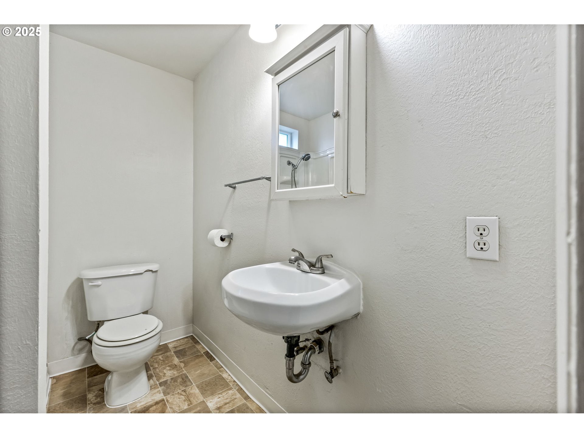 1141 Southeast Lewis Street Dallas, OR 97338 - Photo 11 of 20 a bathroom with a toilet sink and mirror