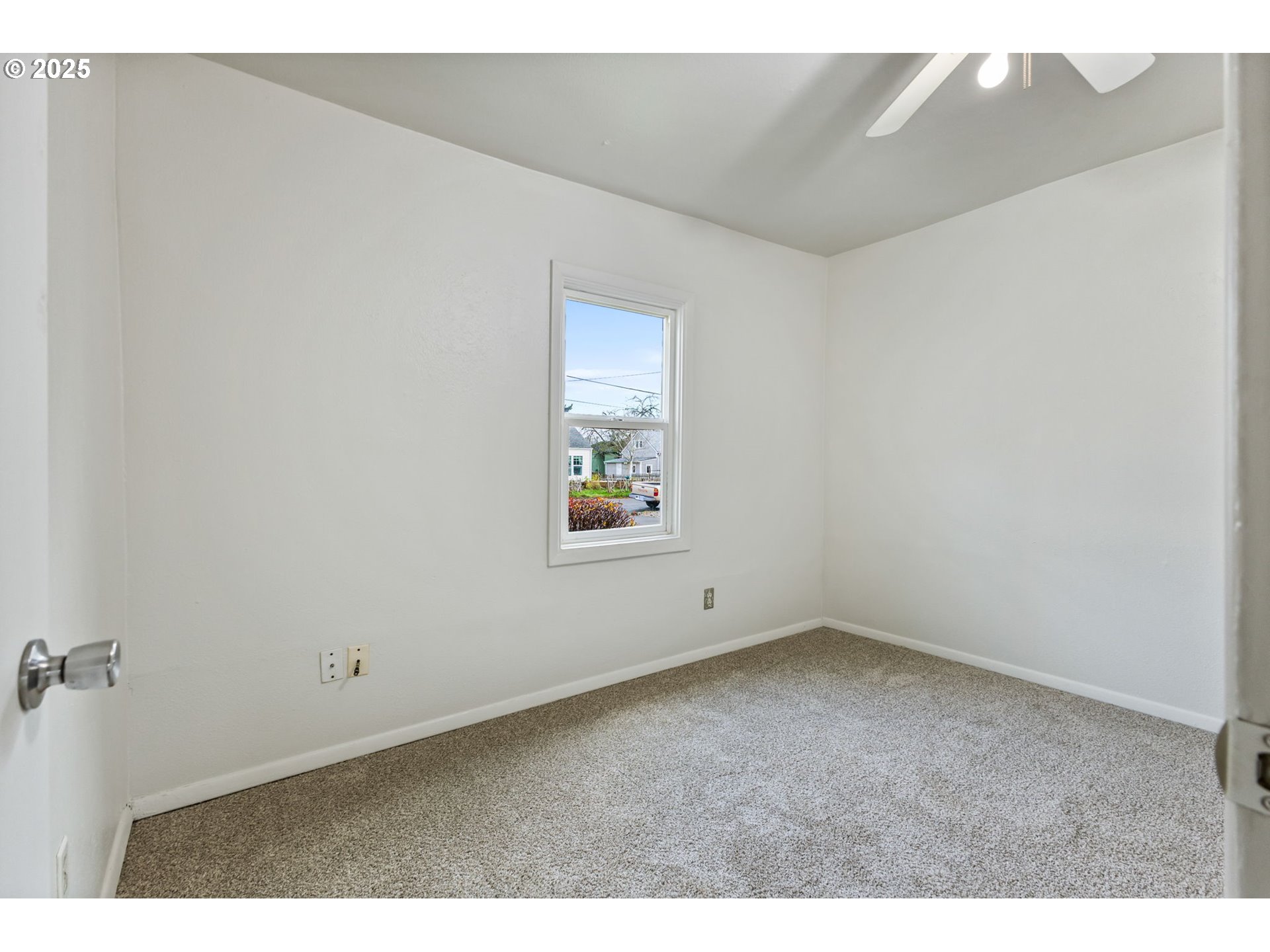 1141 Southeast Lewis Street Dallas, OR 97338 - Photo 12 of 20 a view of an empty room with a window