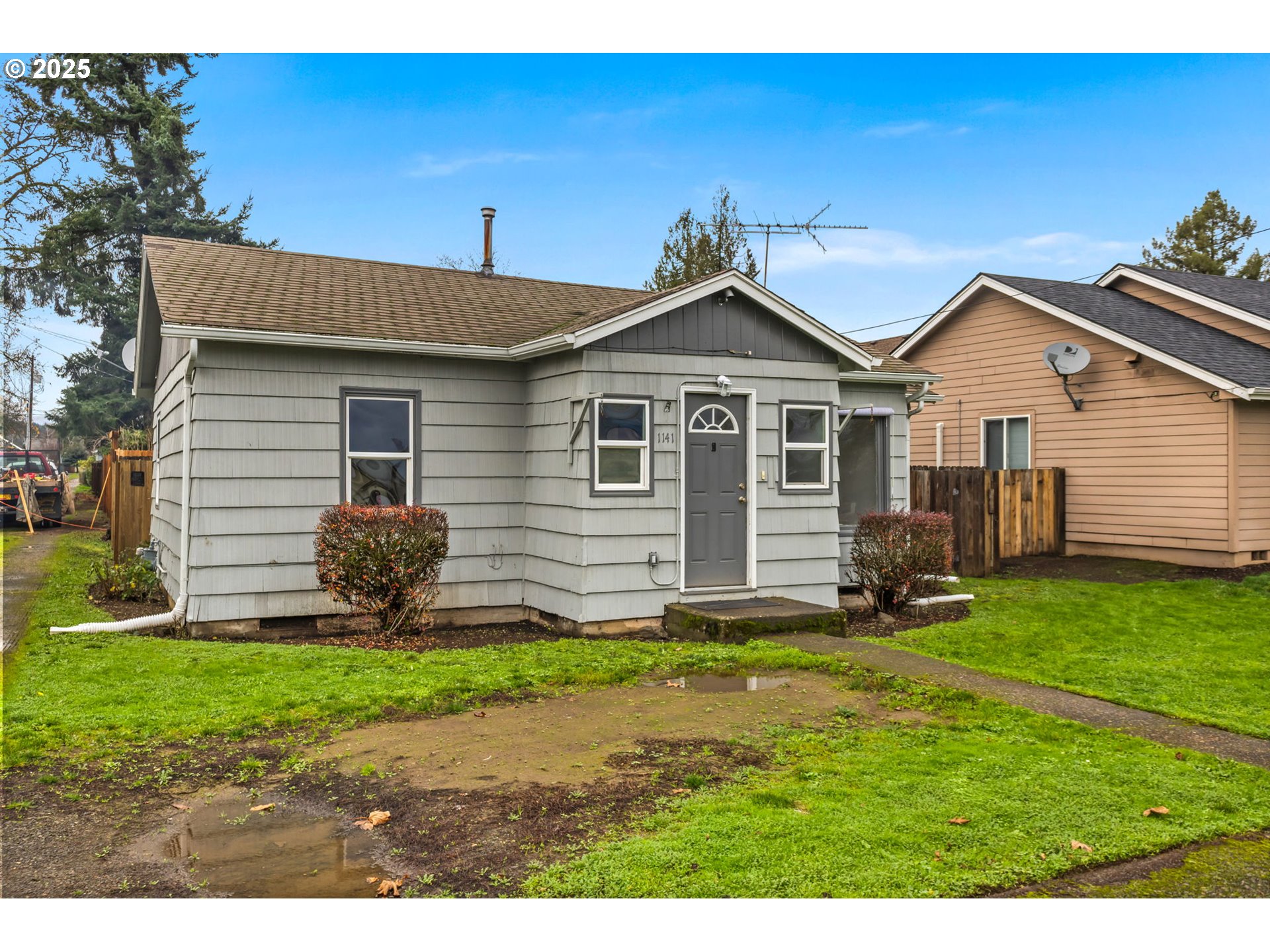 1141 Southeast Lewis Street Dallas, OR 97338 - Photo 3 of 20 a front view of a house with a yard and garage