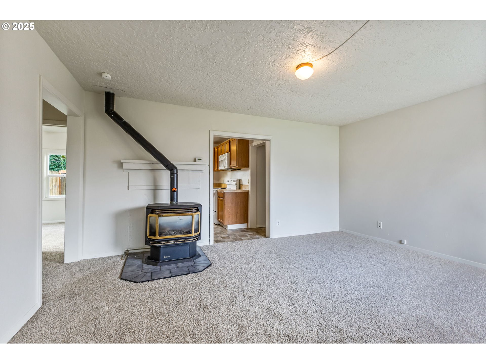 1141 Southeast Lewis Street Dallas, OR 97338 - Photo 5 of 20 a living room with furniture and a flat screen tv