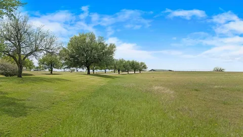 a view of a house with a big yard