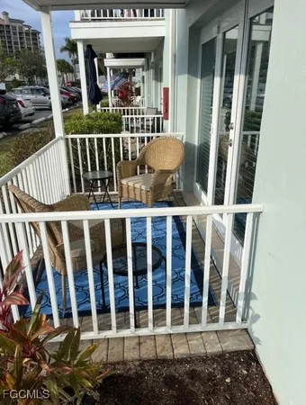 a view of balcony with wooden floor