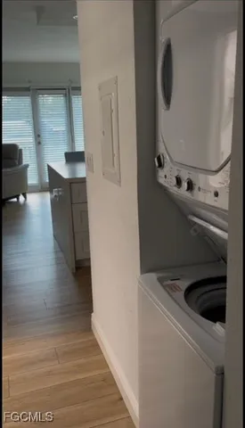 a view of a kitchen from a hallway