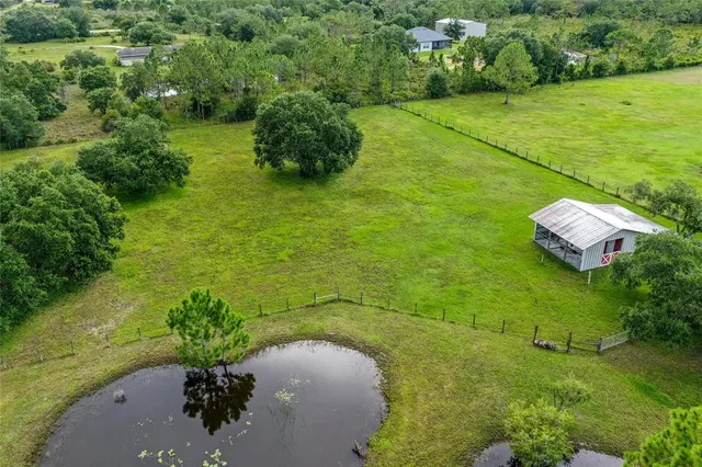 a view of a lake with a yard