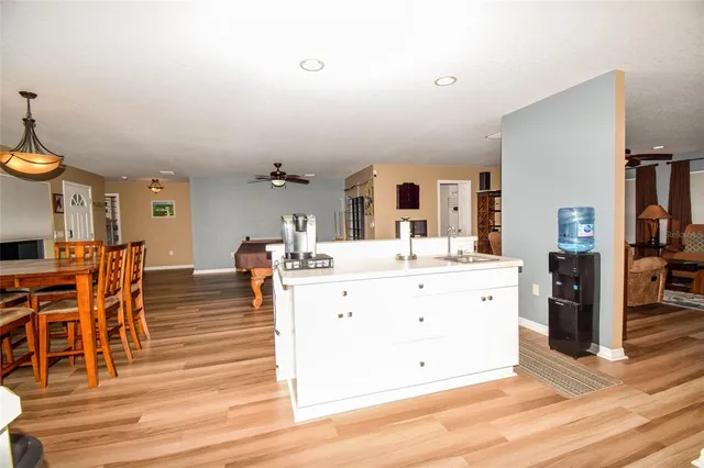 a living room with a couch and wooden floor