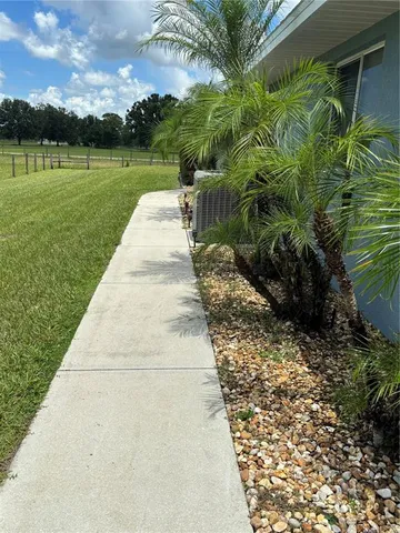 a backyard of a house with lots of green space