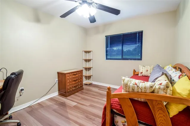 a spacious bathroom with a double vanity sink toilet mirror and bathtub