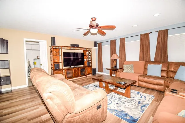 a utility room with cabinets washer and dryer