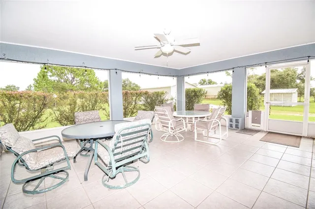 a backyard of a house with lots of green space and wooden floor