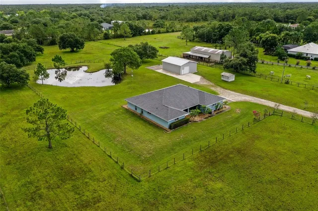 a view of a golf course with chairs