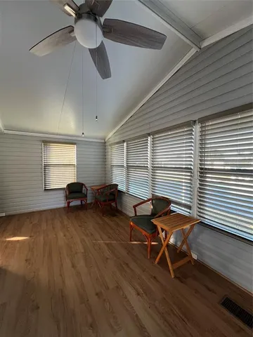 a bedroom with a bed dresser and a window