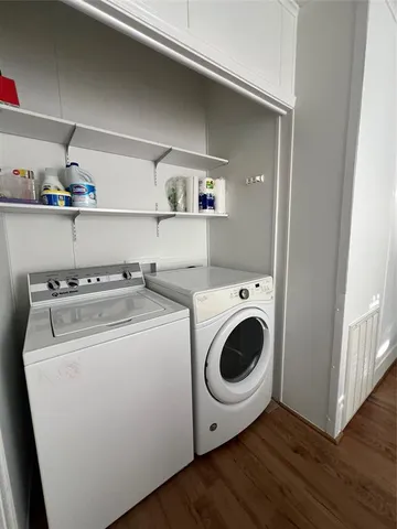 a view of an ocean & house with a yard