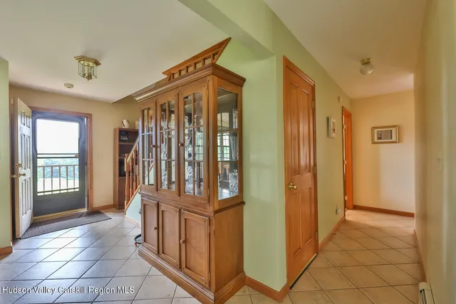 a view of entryway with stairs and a door