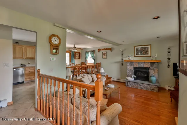 a view of a livingroom with furniture and a fireplace