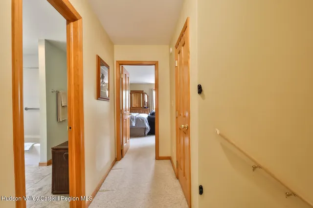 a view of a bathroom from a hallway