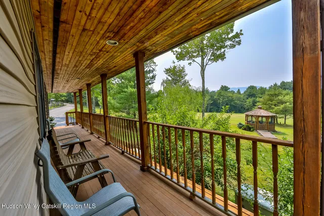 a view of a two chairs in the balcony