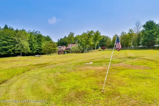 a view of an swimming pool with an outdoor space and seating area