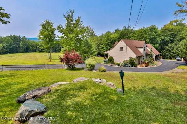 a view of a house with a yard