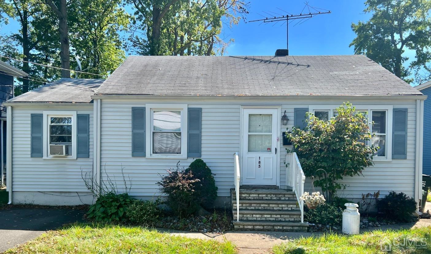 185 East Cliff Road Colonia, NJ 07067 - Photo 1 of 1 a front view of a house with a yard and garage