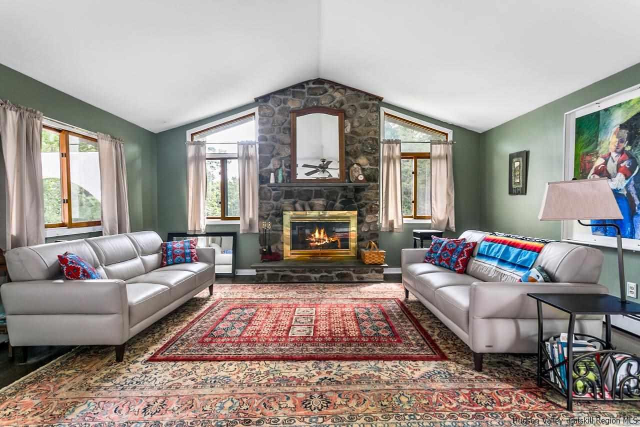 665 Scotchtown Collabar Road Middletown, NY 10941 - Photo 4 of 22 a living room with furniture and a fireplace