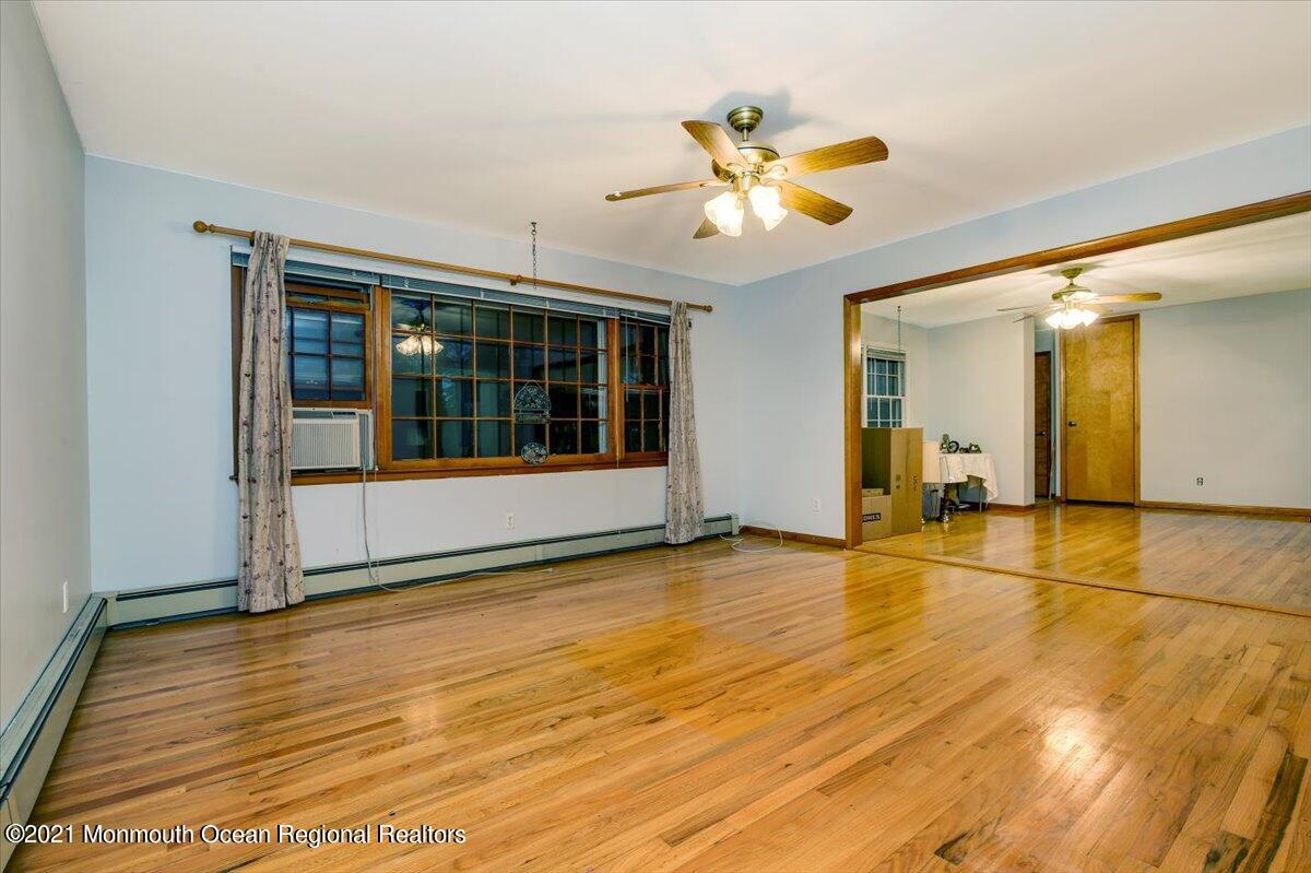 14 Hilltop Terrace Wayne, NJ 07470 - Photo 23 of 34 a view of a room with wooden floor and ceiling fan