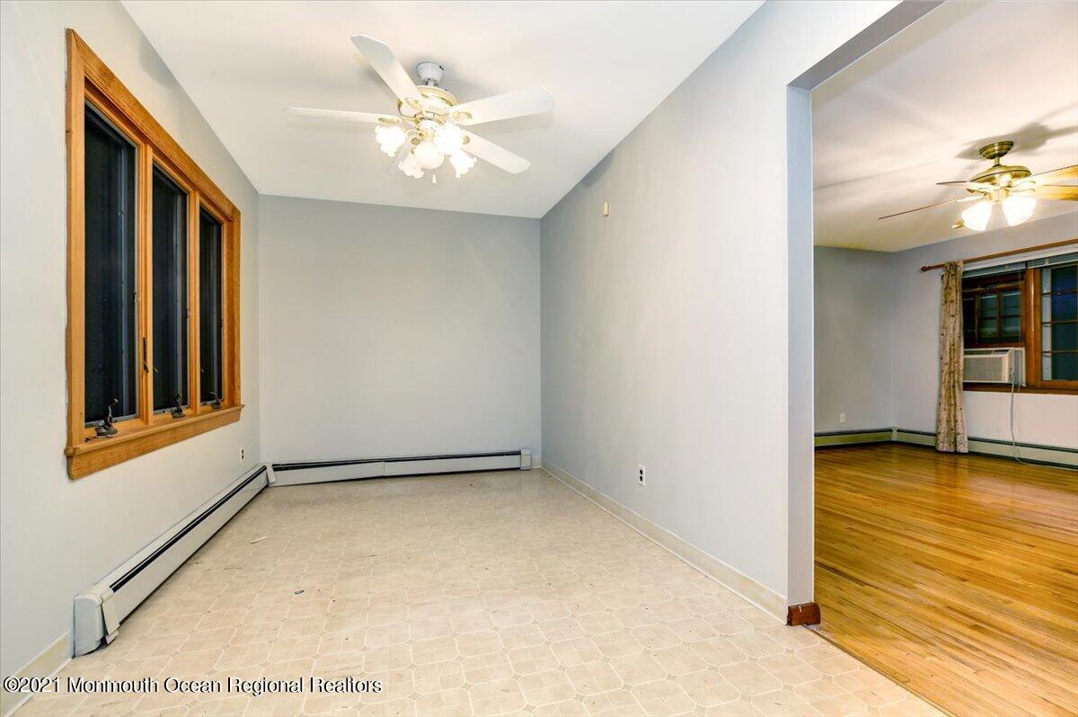14 Hilltop Terrace Wayne, NJ 07470 - Photo 24 of 34 an empty room with windows and ceiling fan