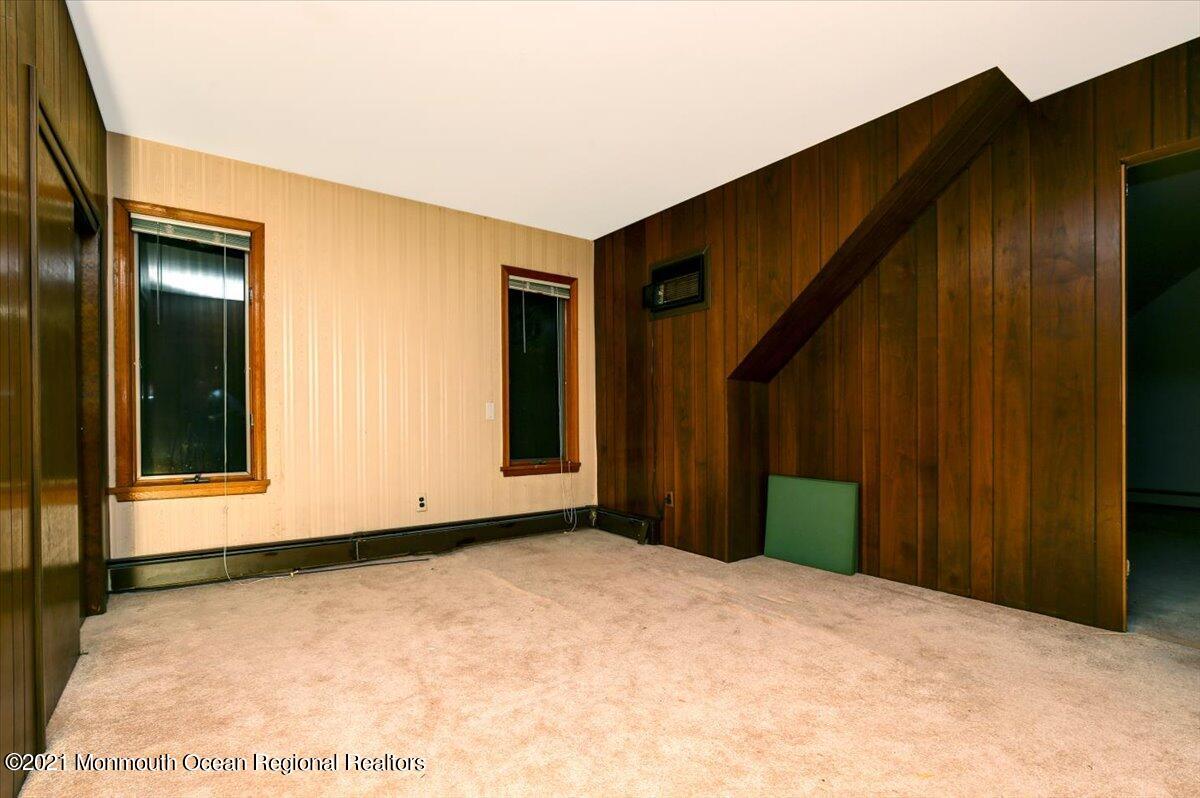 14 Hilltop Terrace Wayne, NJ 07470 - Photo 34 of 34 a view of an empty room with wooden floor and a window