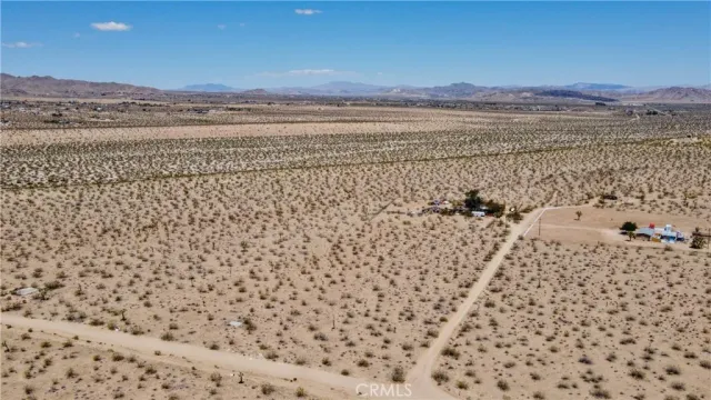 a view of a large body of water with a building in the background