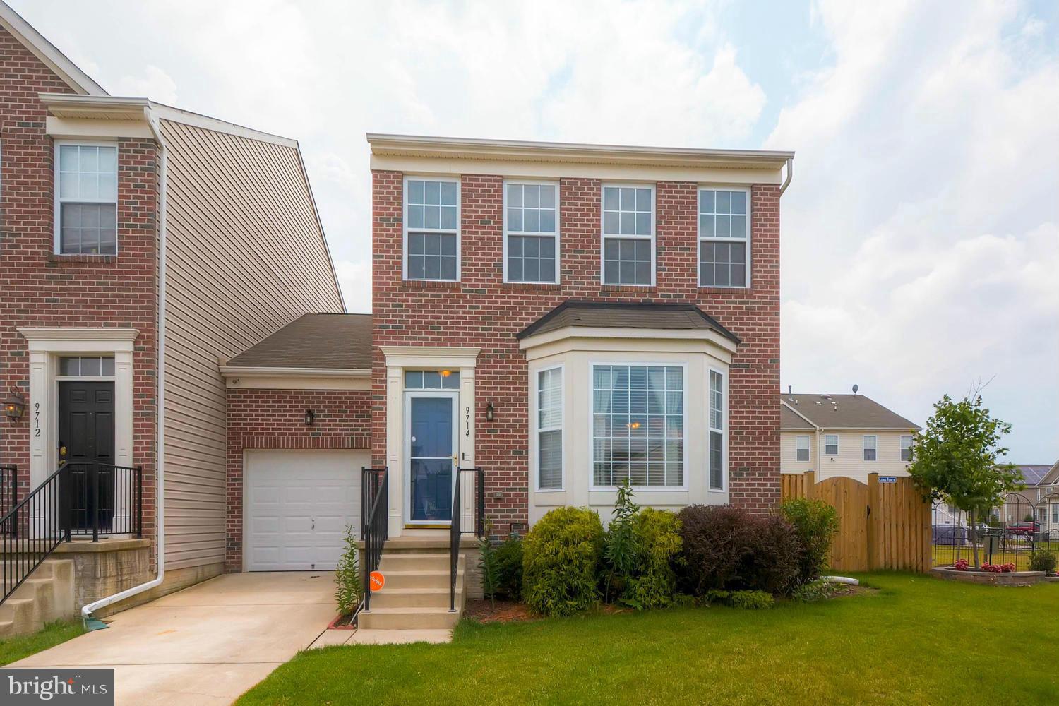 9714 Langley Road Baltimore, MD 21220 - Photo 1 of 27 a front view of a house with garden