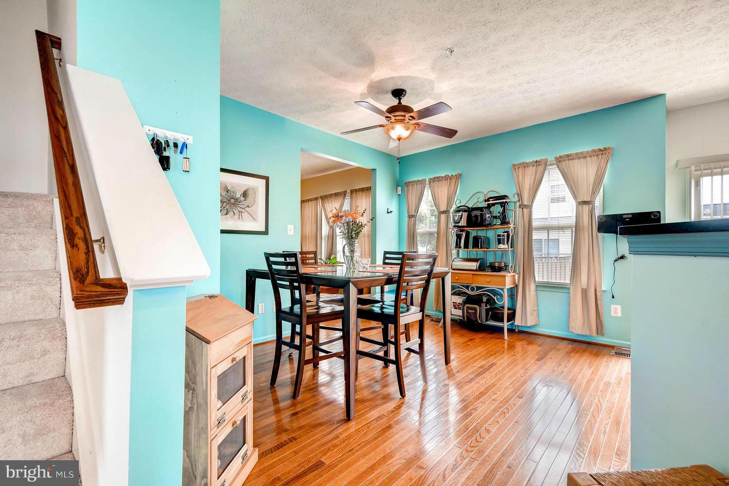 9714 Langley Road Baltimore, MD 21220 - Photo 11 of 27 a view of a dining room with furniture and wooden floor